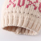 Cream XOXO knit beanie pom pom hat