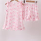 Pink bow print scalloped ruffle shorts set