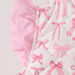 Pink bow ruffle vest