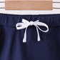 Navy scallop hem bow skort