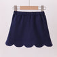 Navy scallop hem bow skort
