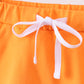 Orange scallop hem bow skort