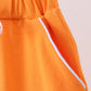 Orange scallop hem bow skort