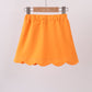 Orange scallop hem bow skort