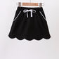 Black scallop hem bow skort