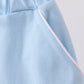 Mint scallop hem bow skort