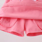 Deep pink scallop hem bow skort