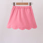 Deep pink scallop hem bow skort