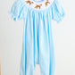Blue puppy hand smocked girl romper