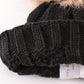 Black pompom cable beanie hat