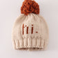 Beige pompom hi cable beanie hat