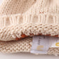 Beige pompom hi cable beanie hat