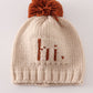 Beige pompom hi cable beanie hat