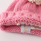 Pink pompom hi cable beanie hat