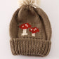 Brown pompom mushroom cable beanie hat