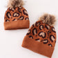 Brown pompom leopard cable beanie hat