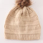 Beige pompom cable beanie hat