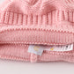 Pink pompom cable beanie hat