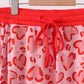 Red heart print bamboo pants