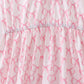 Pink bow ruffle tiered dress