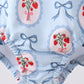 Blue strawberry bow ruffle rashguard