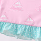 Pink sailboat print ruffle rashguard set