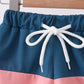 Colorblock fish embroidery swim trunks