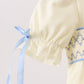 Cream smocked bubble