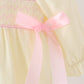 Cream smocked bow bubble