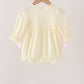 Cream smocked bow bubble